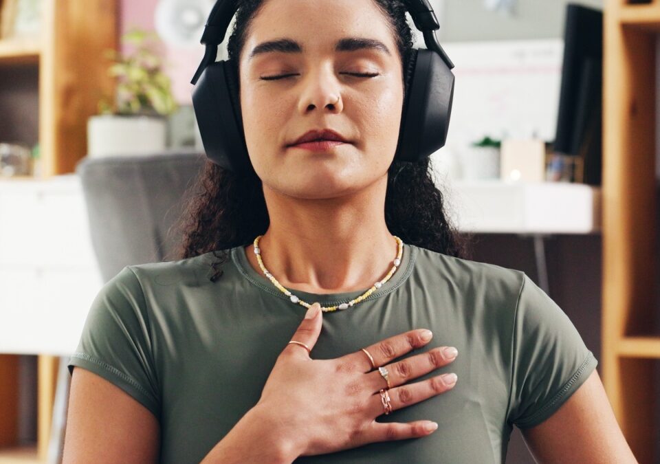 Woman, relax and audio therapy with headphones for zen, breathing exercise or technique in home. Female person, yoga and relaxation with sound in meditation for inner peace, mindfulness or balance