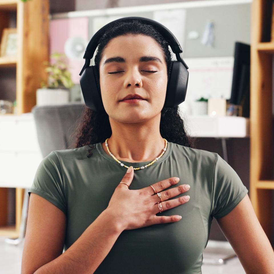 Woman, relax and audio therapy with headphones for zen, breathing exercise or technique in home. Female person, yoga and relaxation with sound in meditation for inner peace, mindfulness or balance